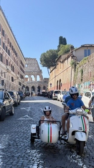 A Vespa and sidecar tour near the Colosseum in Rome